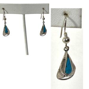 Turquoise and alpaca silver dangle earrings.